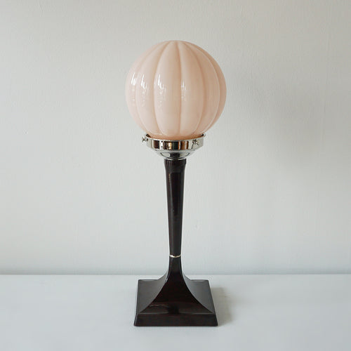 An Art Deco style table lamp. Brown bakelite square stem with peach pink glass globe shade - Jeroen Markies Art Deco