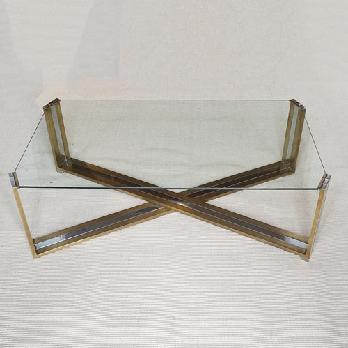 A Mid-Century coffee table designed by Romeo Rega. Brass and chrome X-frame base with inset glass top - Jereon Markies Art Deco