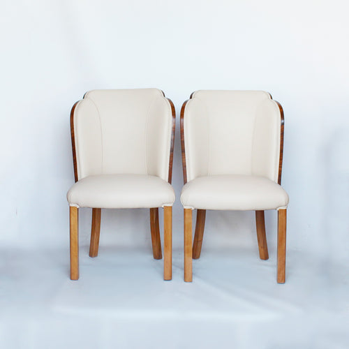 A pair of walnut backed, Art Deco cloud chairs by Harry & Lou Epstein at Jeroen Markies 