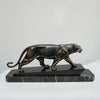 An Art Deco spelter sculpture of a stalking panther by Irénée Rochard. Set over a marble base. 