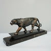 An Art Deco spelter sculpture of a stalking panther by Irénée Rochard. Set over a marble base. 