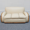 An Art Deco three piece tank Sofa by Heals of london. Made of Burr and solid walnut banding with reeded lower section, Upholstered in cream leather and contrasting faux suede