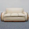 An Art Deco three piece tank Sofa by Heals of london. Made of Burr and solid walnut banding with reeded lower section, Upholstered in cream leather and contrasting faux suede