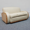 An Art Deco three piece tank Sofa by Heals of london. Made of Burr and solid walnut banding with reeded lower section, Upholstered in cream leather and contrasting faux suede