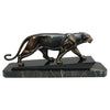 An Art Deco spelter sculpture of a stalking panther by Irénée Rochard. Set over a marble base. 