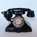 An original GPO telephone in black bakelite. With integral drawer at Jeroen Markies.