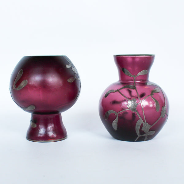 A pair of Art Deco bohemian purple hued glass vases with silver overlay mistletoe design at Jeroen Markies