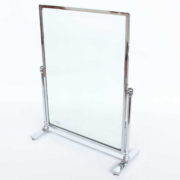 An Art Deco photo frame, on a chrome base, beveled glass liners at Jeroen Markies.