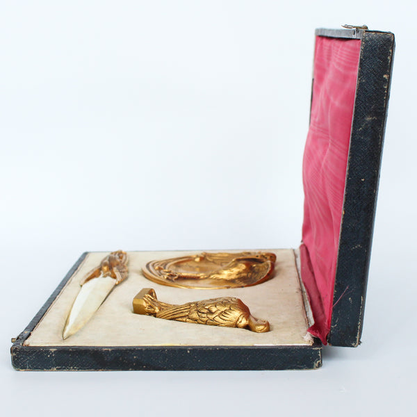 A gilt bronze and onyx in a bird motif, including letter opener and inkwell tray. In fitted presentation case. All signed, "Frecourt". Maurice Frecourt (French 1890) at Jeroen Markies