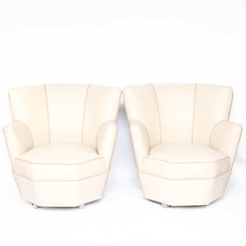 A pair of 1930s three penny piece bedroom/cocktail chairs. Upholstered in cream leather to fronts and faux suede to back and sides with new kendrick chrome casters at Jeroen Markies