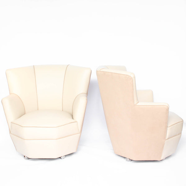 A pair of 1930s three penny piece bedroom/cocktail chairs. Upholstered in cream leather to fronts and faux suede to back and sides with new kendrick chrome casters at Jeroen Markies