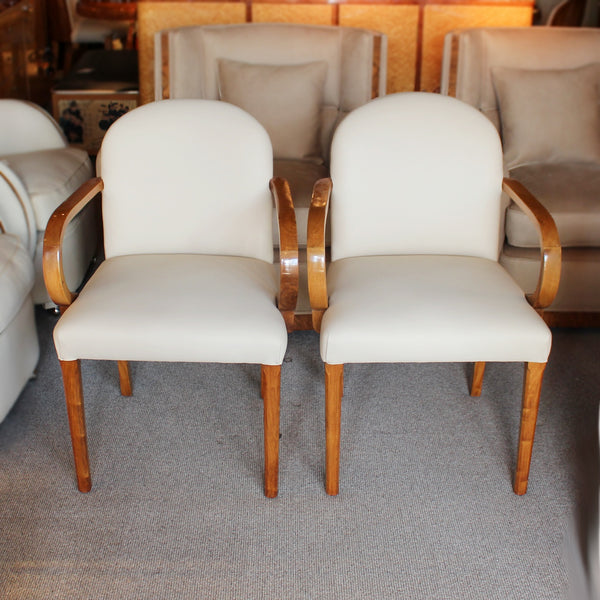 A pair of Art Deco side chairs with curved walnut arms