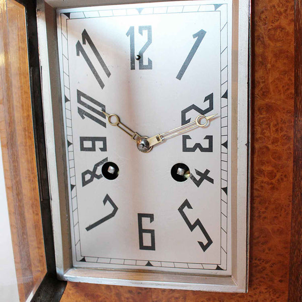 An Art Deco mantel clock in amboyna with metal face circa 1930 at Jeroen Markies 