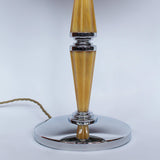 A pair of large Art Deco dome lamps with fluted bakelite stems and chromed metal domes at Jeroen Markies