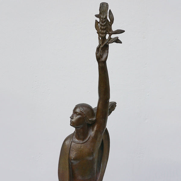 An Art Deco bronze sculpture of Ceres the Roman goddess of agriculture, fertility and motherly relationshios, holding alot a strand of wheat, bear breasted with a shawl around her and her hair flowing in the wind by André Bizette-Lindet 