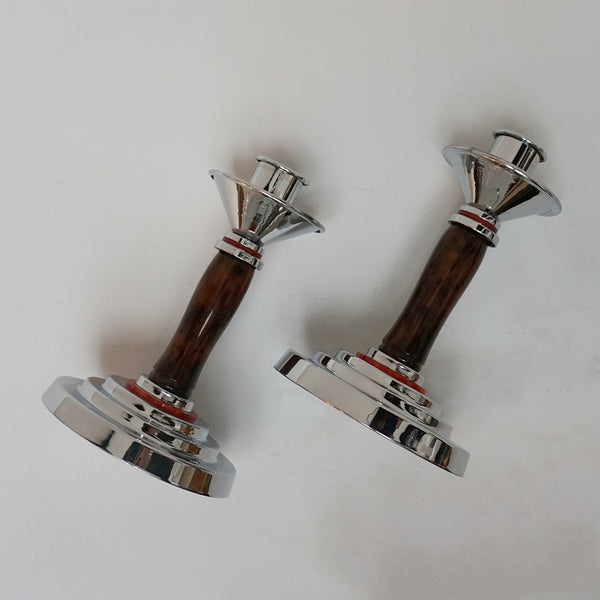 A pair of Art Deco candlesticks. Brown bakelite stem with red bakelite rings. Jeroen Markies Art Deco.