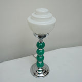 An Art Deco table lamp. Green bakelite balls with chromed banding to stem. Set over stepped circular base - Jeroen m