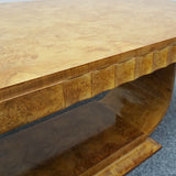 An Art Deco dining table by Harry & Lou Epstein. The table top is burr walnut veneered. 