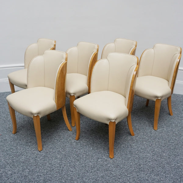Art Deco cloud backed armchairs upholstered in cream leather by Harry & Lou Epstein. 