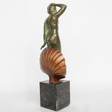 Venus, an Art Deco verdigris patinated and cold painted bronze sculpture. Depicts the figure of Venus emerging, set over a marble plinth. Chips to marble at Jeroen Markies
