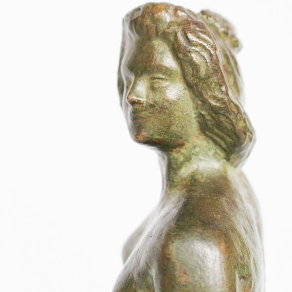 Venus, an Art Deco verdigris patinated and cold painted bronze sculpture. Depicts the figure of Venus emerging, set over a marble plinth. Chips to marble at Jeroen Markies