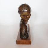 Amadeo Gennarelli Art Deco bronze bust of a young woman set over a wooden plinth at Jeroen Markies