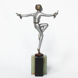 An Art Deco, cold painted bronze figure by Josef Lorenzl (1892-1950). A dancing woman in stylised pose set over a green onyx plinth at Jeroen Markies