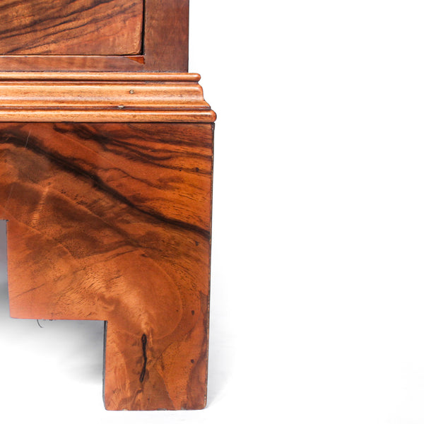 Art Deco walnut chest of drawers. Original gilt bronze handles. Mahogany lined drawers. Stepped bracket feet at Jeroen Markies.