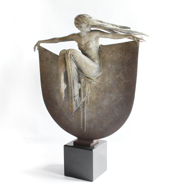 Grace, a limited edition, patinated bronze figure of a dancer in draping robe. Set over a granite plinth.  After completing a Masters degree at the Royal Academy in London 1980, Michael Talbot was led to working under Colin Melbourne ARCA and Dame Elizabeth Frink RA. He was elected to the Royal British Society of Sculptors in 1997.  Signed and numbered edition of 12