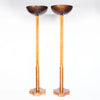 A pair of Art Deco uplighter floor lamps by Harry & Lou Epstein. Made of walnut and satin wood with domed copper shades.