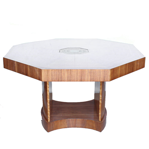 An Art Deco, octagonal dining/centre table in walnut and satin wood veneer with original light in the centre.