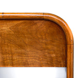 An Art Deco, two drawer desk in satin wood veneer with oak and satin birch drawer linings. Original brass handles.