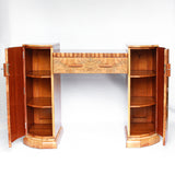 An Art Deco console sideboard by Hille. Burr walnut veneer throughout. Scallop-edged detail to front with integral drawer. Shelved cabinets to either side.