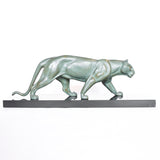 An Art Deco, patinated bronze study of a prowling lioness, mounted on a black marble base. Signed 'M. Leduc' at Jeroen Markies.