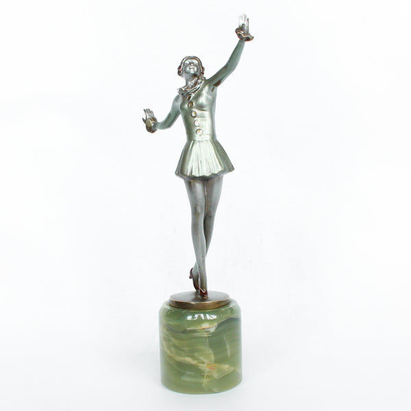 An Art Deco, cold painted bronze figure of an elegant dancer in a striking pose, raised on a green onyx base.  Signed Lorenzl to bronze