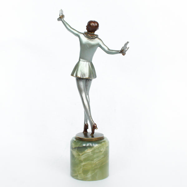 An Art Deco, cold painted bronze figure of an elegant dancer in a striking pose, raised on a green onyx base.  Signed Lorenzl to bronze