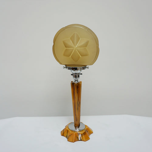 An Art Deco table lamp. Marbled amber bakelite base and stem inset with chrome. Yellow glass circular shade - Jeroen Markies Art Deco
