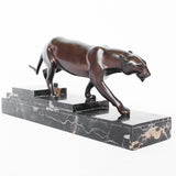 An Art Deco, patinated bronze study of a prowling panther, set over an integral marble base. Signed H Molins to marble and cast and stamped with foundry mark to cast at Jeroen Markies