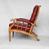 A pair of Philip Webb Arts & Crafts reclining armchairs circa 1900