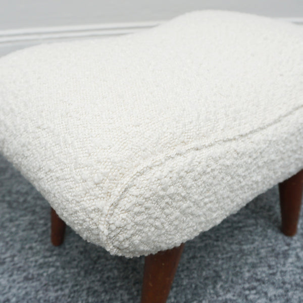  A Pair of Mid Century Footstools  re-upholstered in white Bouclé with tapered teak feet