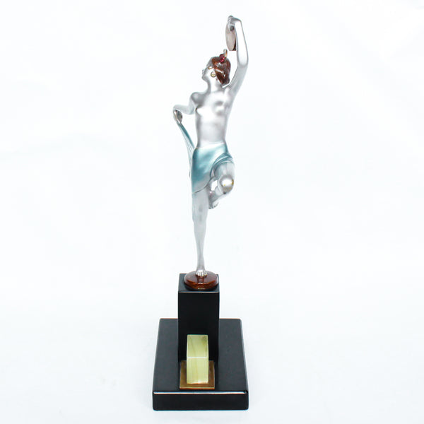 An Art Deco, cold painted bronze figure of an elegant dancer holding a tambourine, raised on a green onyx base.  Signed Lorenzl to bronze