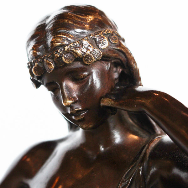 Captive, an Art Nouveau rich brown patinated bronze figure of a scantily clad young lady. Signed Hip Moreau to cast, and with title plaque to front at Jeroen Markies