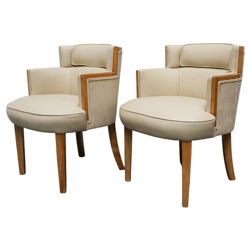 A pair of Art Deco bankers chairs birdseye maple veneered with solid satin birch legs. Upholstered in cream leather and contrasting oatmeal faux suede.